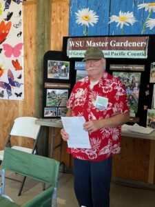 Master Gardener volunteer at the Pacific County Fair exhibit