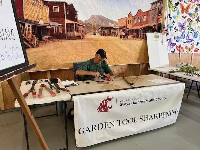 Master Gardener volunteer at the Pacific County Fair exhibit